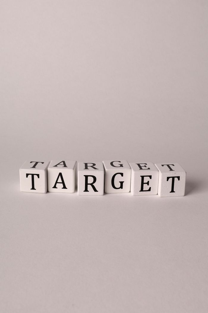 White blocks spelling TARGET on a neutral background with ample copy space.